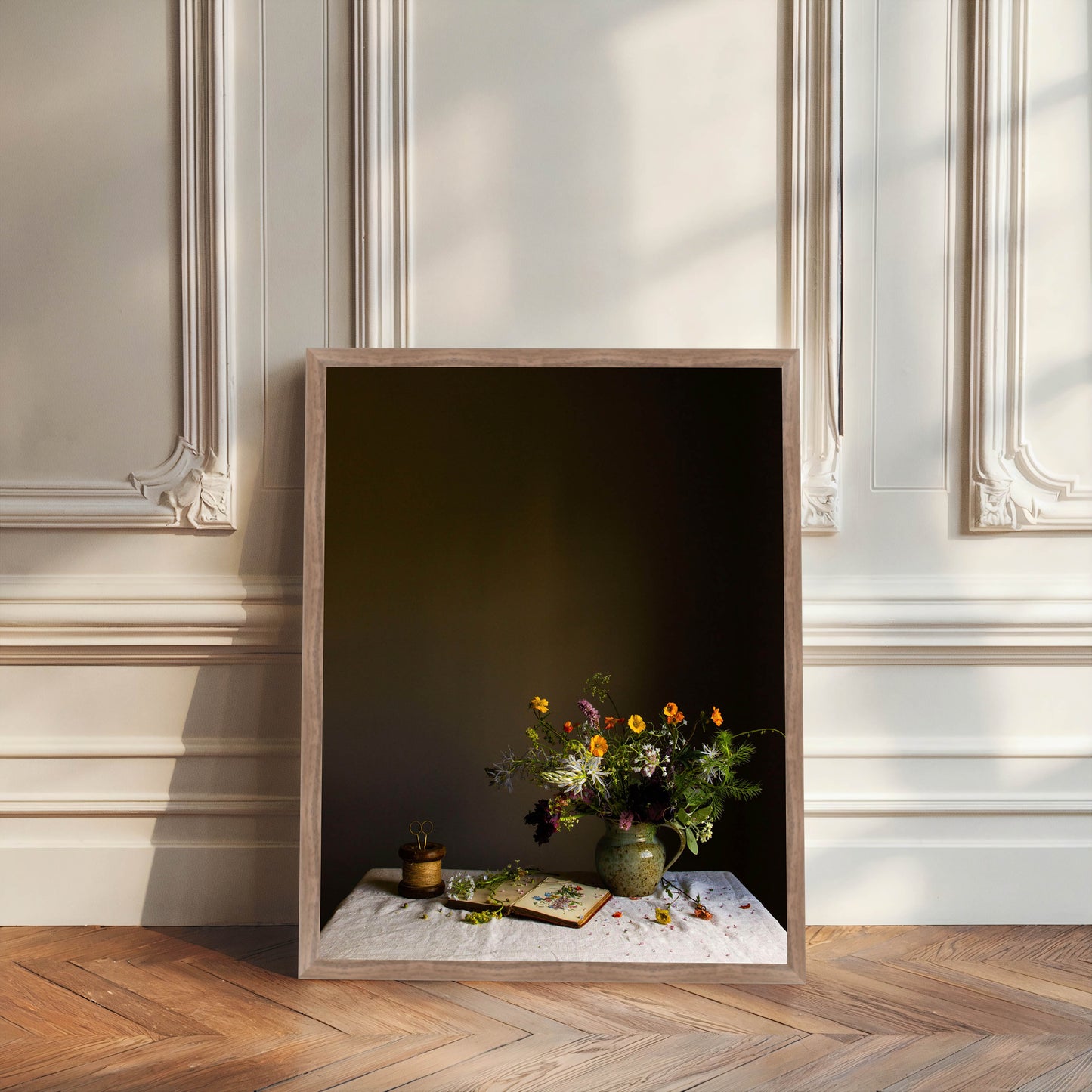 Framed artwork of a still life scene with flowers and books on a table against a dark background. Floral photography