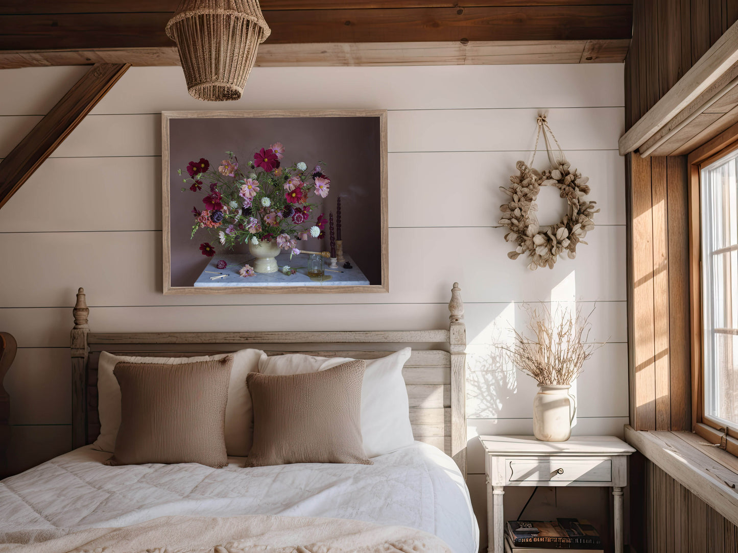 Cozy bedroom with floral still-life photograph, wreath, and natural light