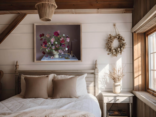 Cozy bedroom with floral still-life photograph, wreath, and natural light