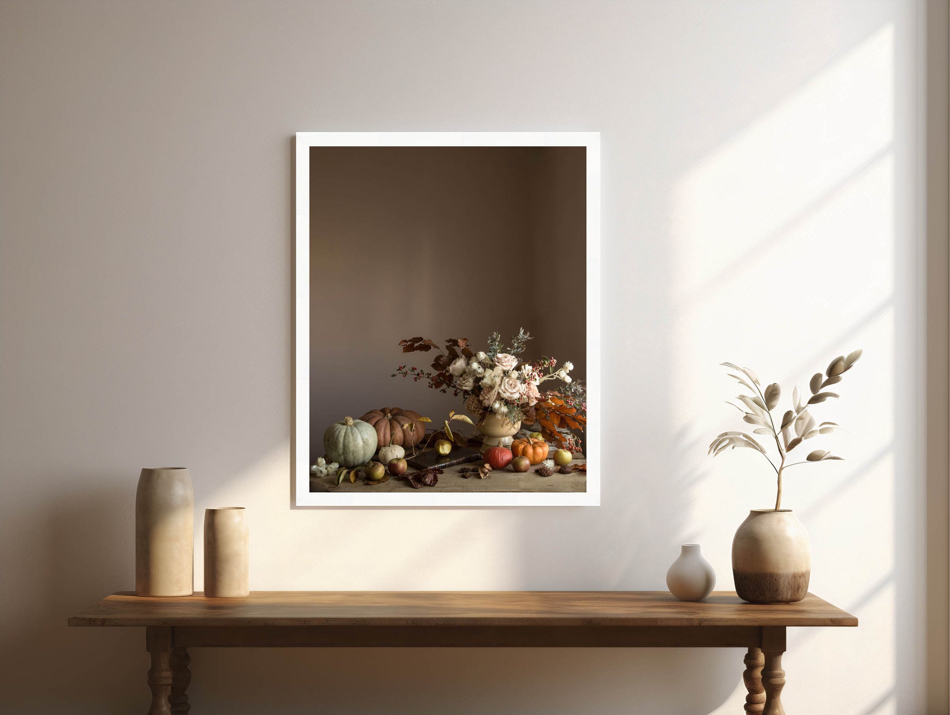 Framed artwork of a still life scene with flowers and fruits on a wooden table.