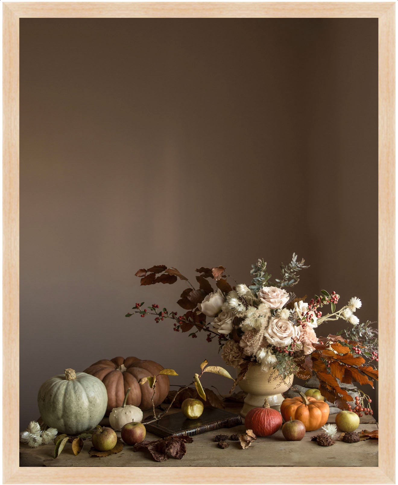Framed botanical still life art with pumpkins and flowers on a dark background
