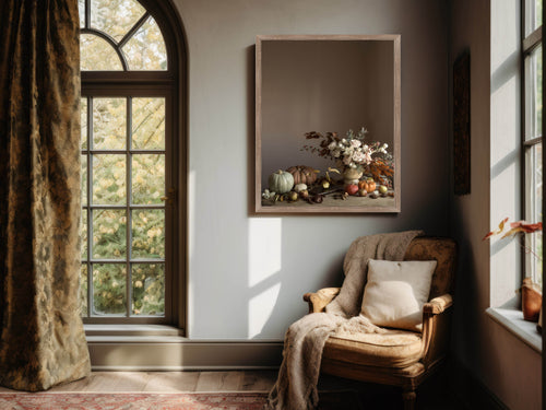 Cozy corner with a chair, framed floral art, and large window