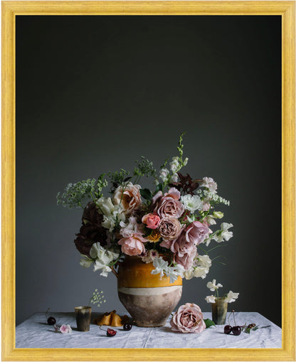 Floral arrangement in a vase on a table with a dark background.   Floral photography
