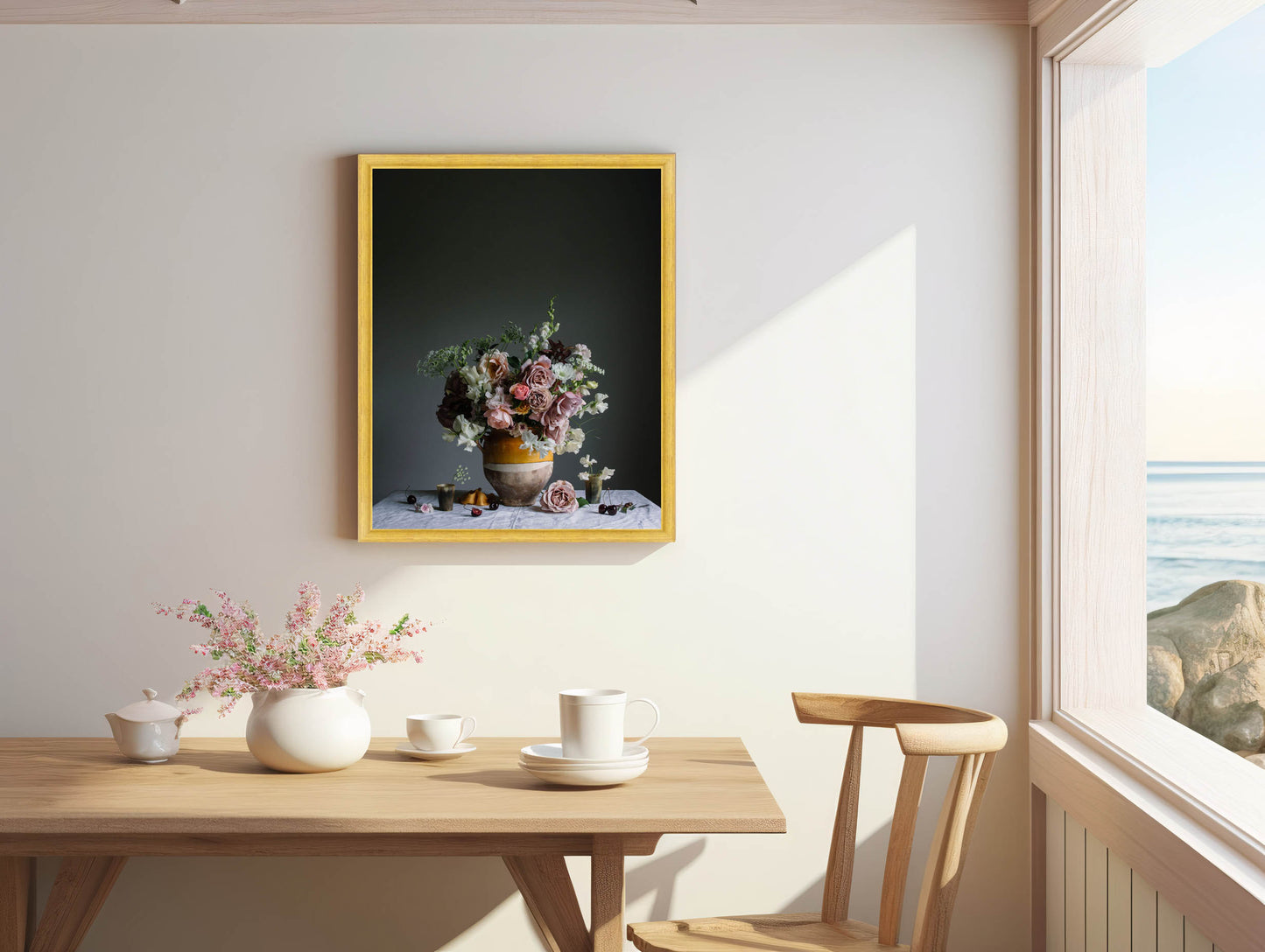 Dining room with a table set for a meal, framed artwork on the wall, and a window view.   Floral print