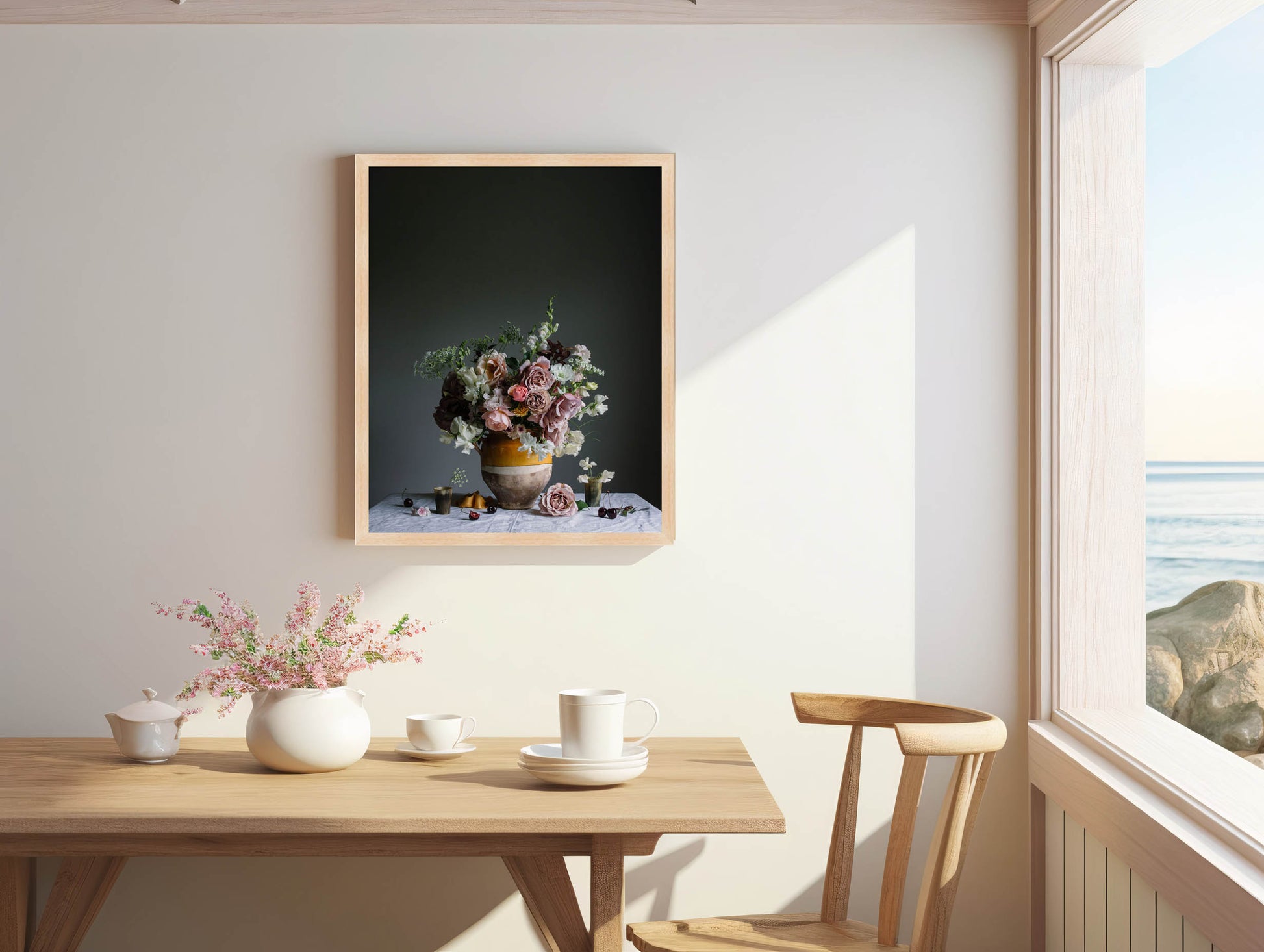 Dining room with a table, chairs, and a framed artwork on the wall.   Botanical art