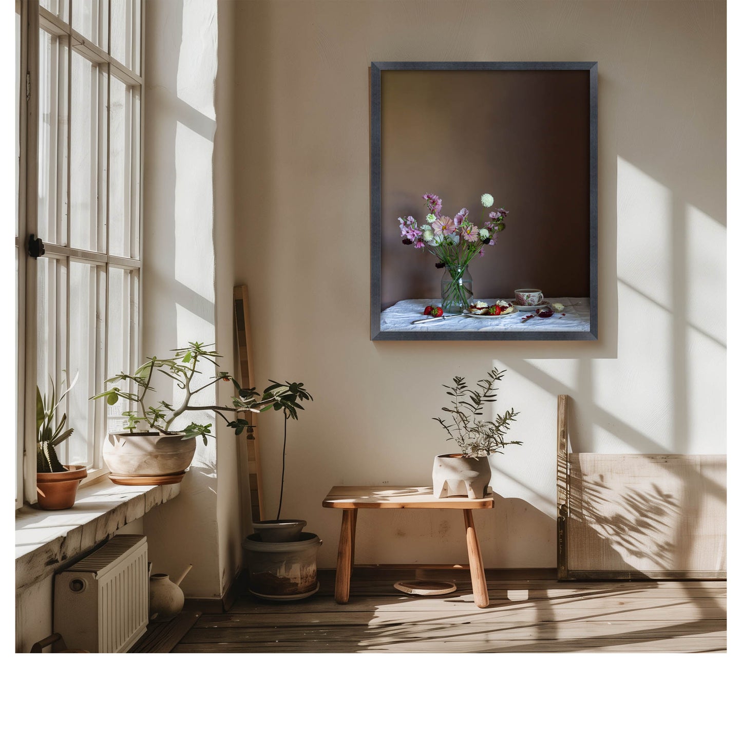 Living room with a vase of flowers on a table, framed floral still-life picture on the wall, and plants.