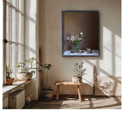 Living room with a vase of flowers on a table, framed floral still-life picture on the wall, and plants.