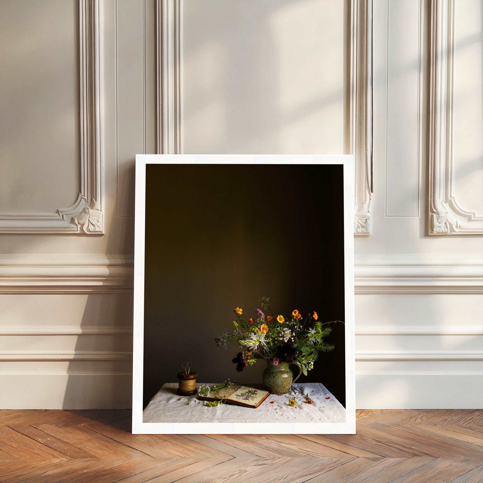 Framed artwork of a still life scene with flowers and books on a table against a dark background.   Botanical artwork
