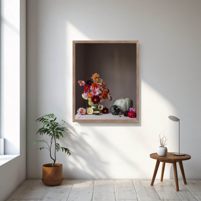 Framed artwork of a still life with flowers and vegetables on a wall in a bright room.   Floral photograph.