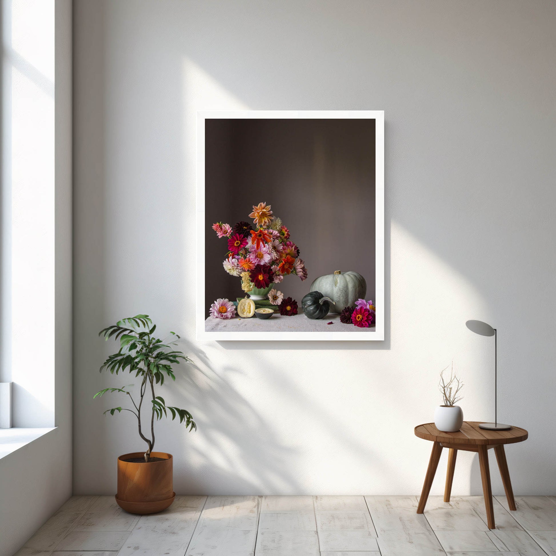 Framed still life artwork with flowers and vegetables on a wall in a bright room.   Botanical print.