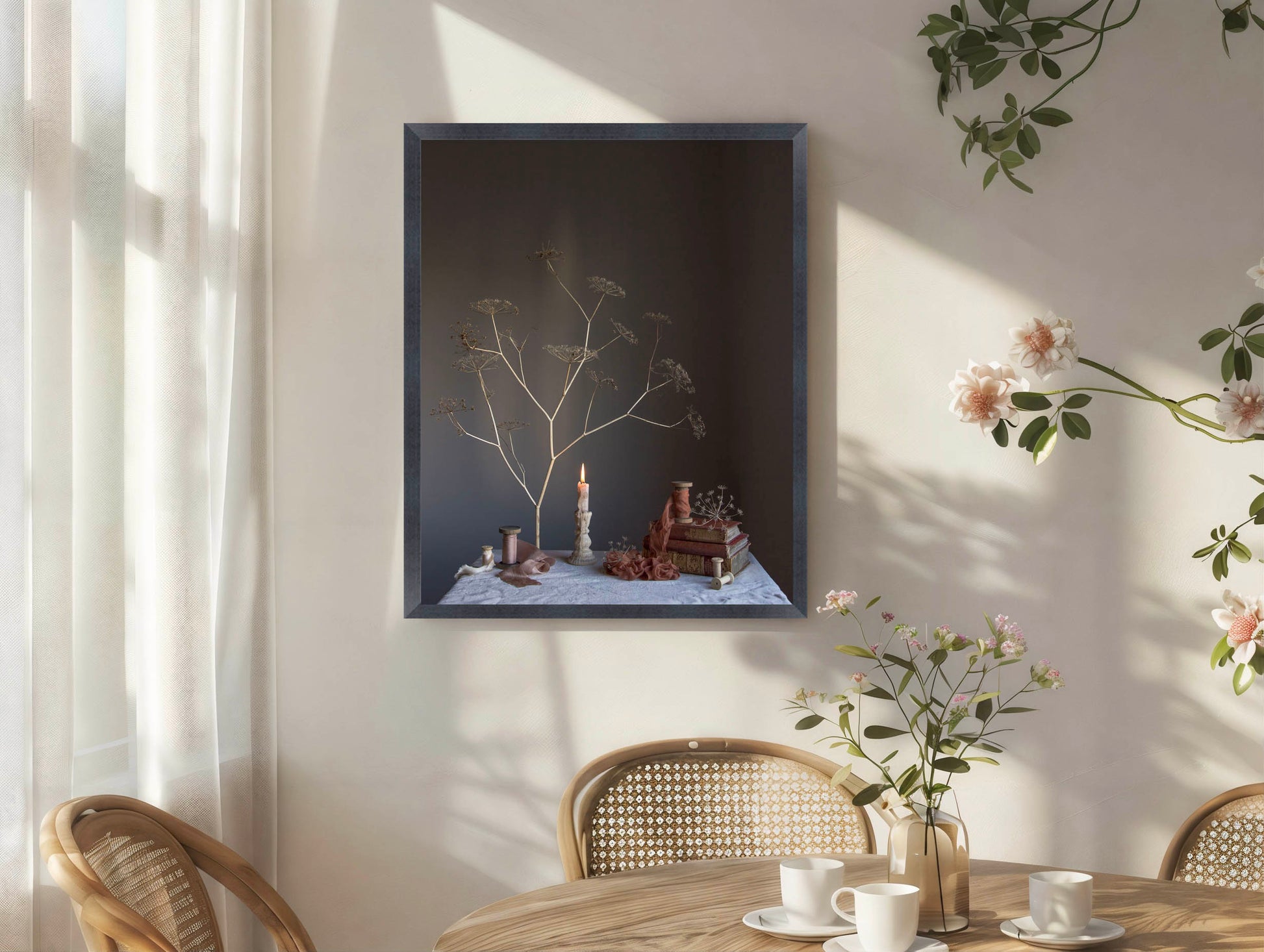 Framed artwork on a wall with a table and chairs in the foreground.   Botanical photograph.