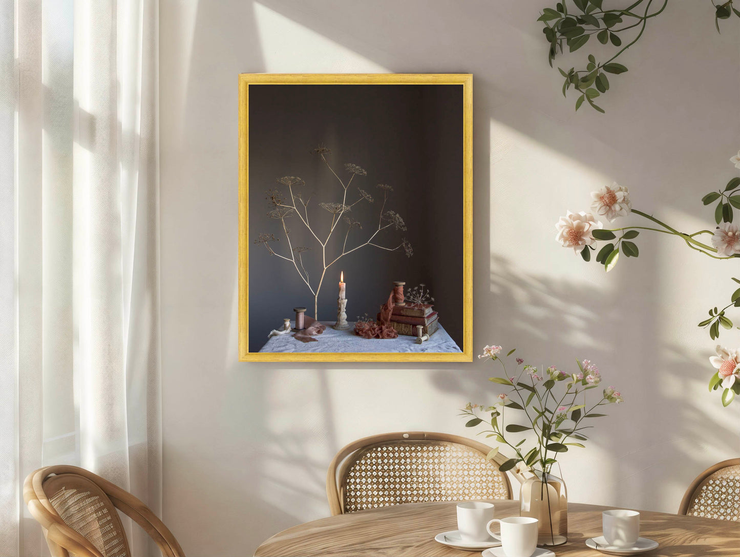 Framed artwork on a wall with a table and chairs in the foreground.  Botanical art.