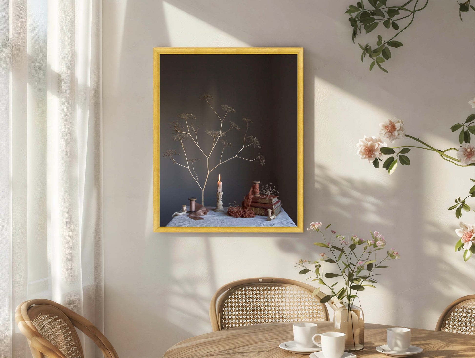 Framed artwork on a wall with a table and chairs in the foreground.  Botanical art.