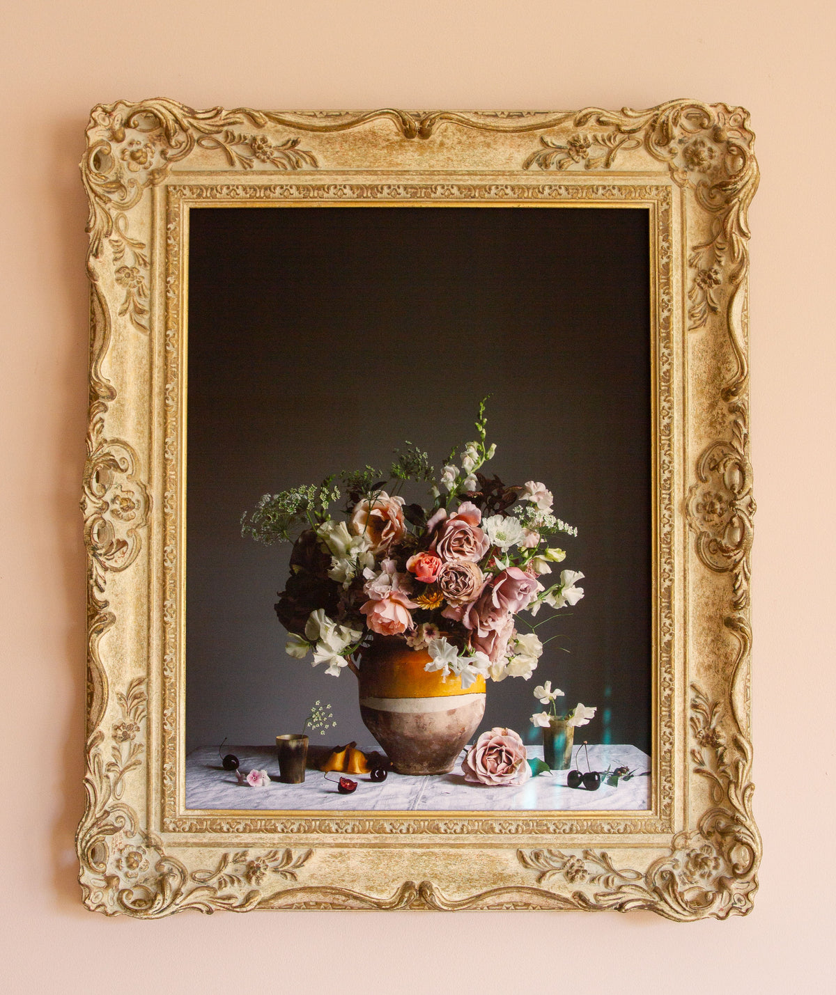 Framed artwork of a still life with roses and cherries in vintage frame by photographer Emma Harris