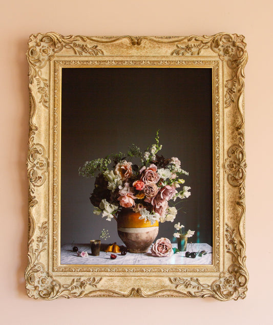 Framed artwork of a still life with roses and cherries in vintage frame by photographer Emma Harris