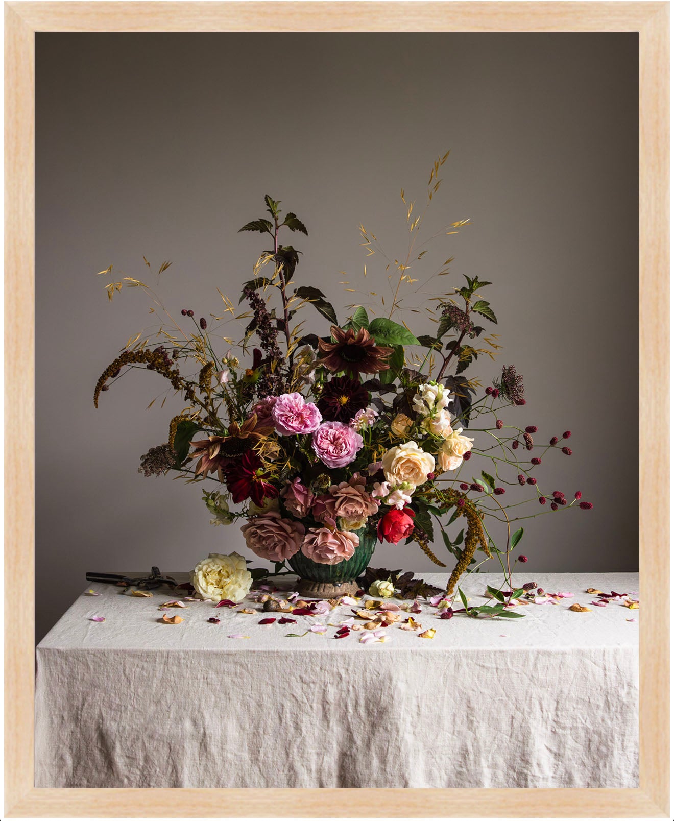 Floral arrangement on a table with a neutral background.   flower artwork