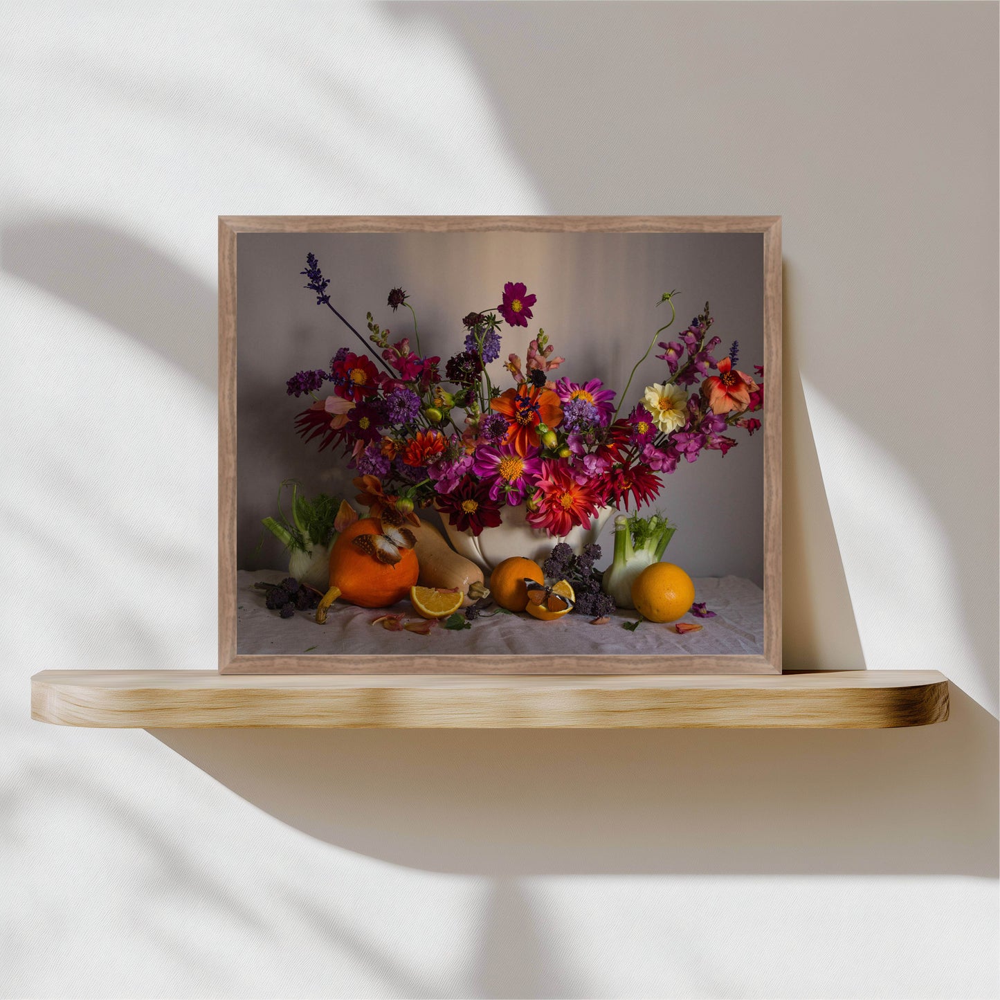 Framed still life with flowers and fruits on a wooden shelf
