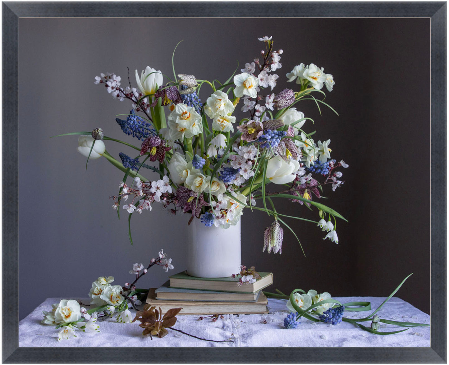Floral arrangement in a white vase on a dark background.  Botanical photograph