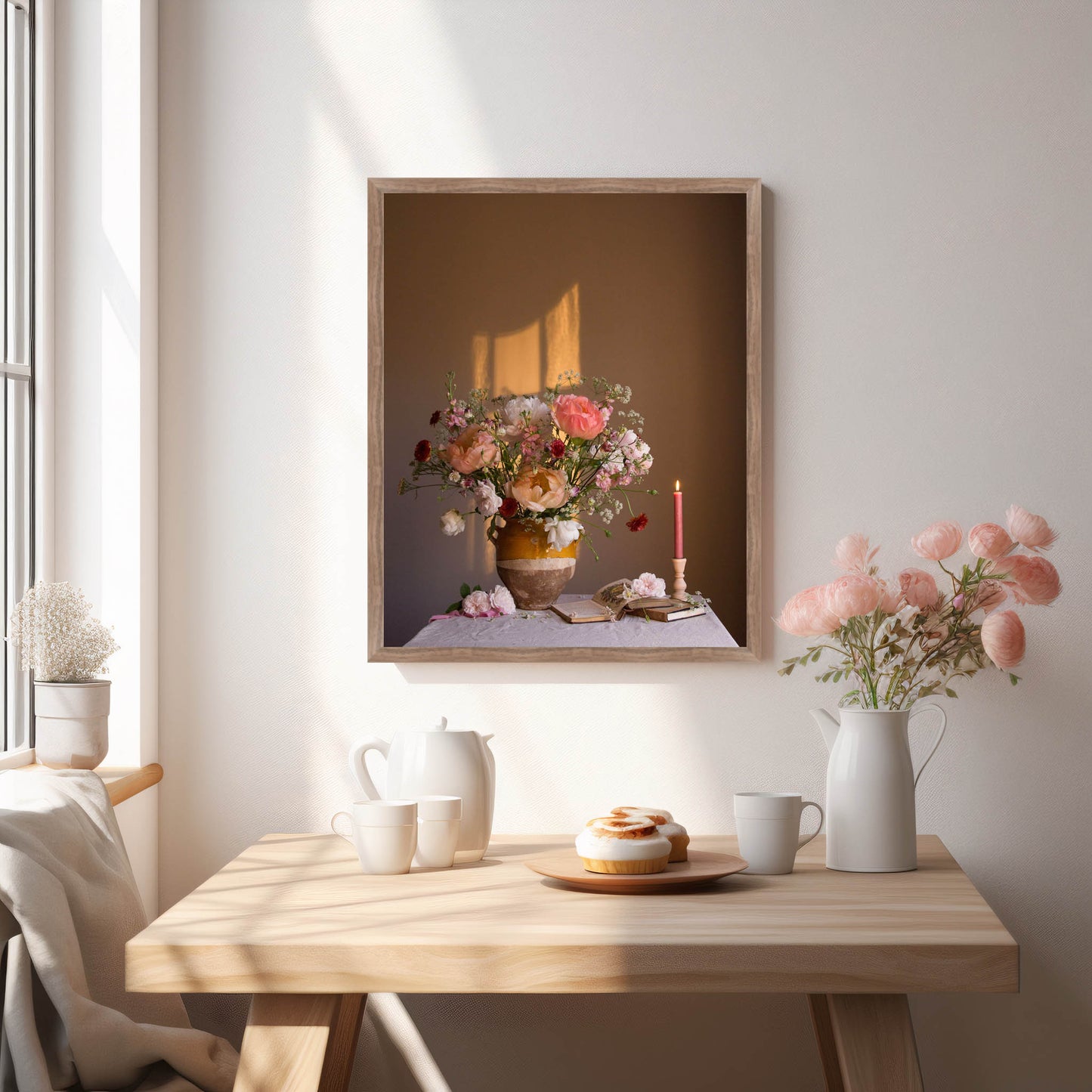 Framed artwork of a floral still life on a wall above a wooden table with decor items.   Flower print