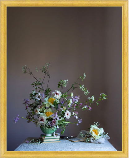 Floral arrangement in a green vase on books with a wooden frame.   Botanical art