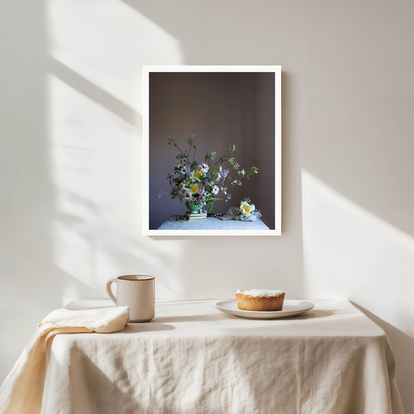 Framed artwork of a still life with flowers on a table, sunlight casting shadows.   Flower art