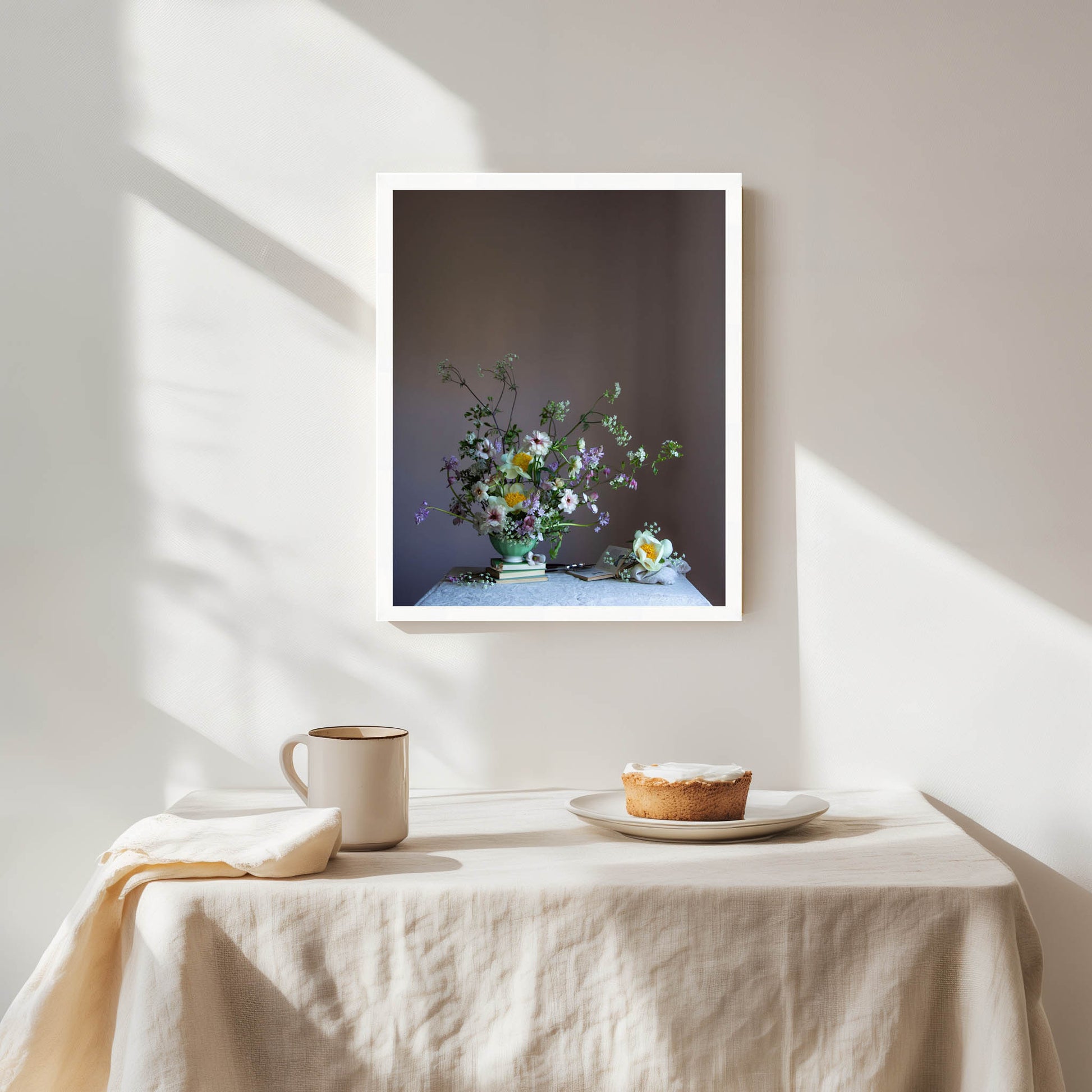 Framed artwork of a still life with flowers on a table, sunlight casting shadows.   Flower art