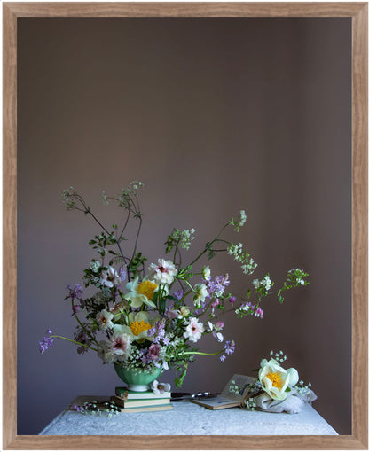 Floral arrangement in a green vase on a table with a brown frame.   Flower print