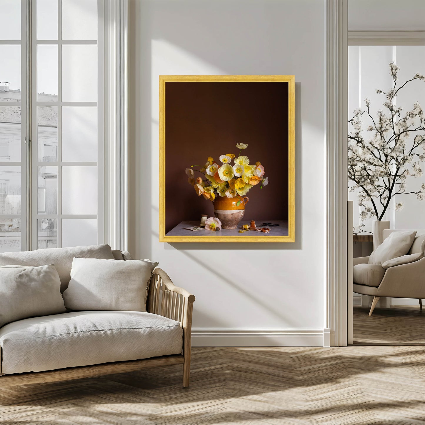 Framed artwork of a floral still life on a wall in a modern living room.
