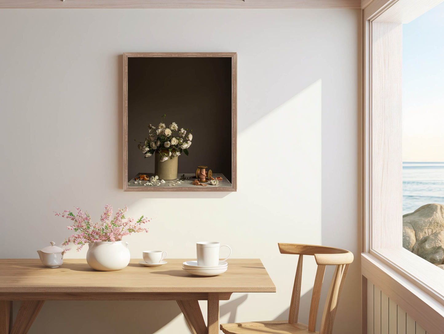 Dining area with a wooden table, chairs, and decorative items.   Floral photograph