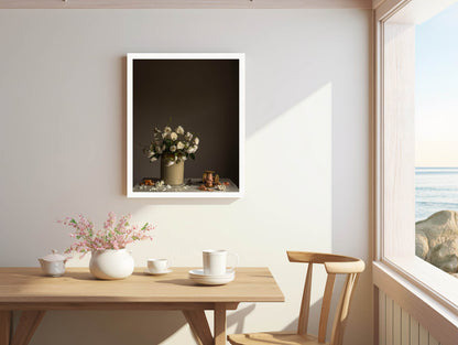 Dining room with a wooden table, chairs, and a vase of flowers on the wall.    Flower photograph