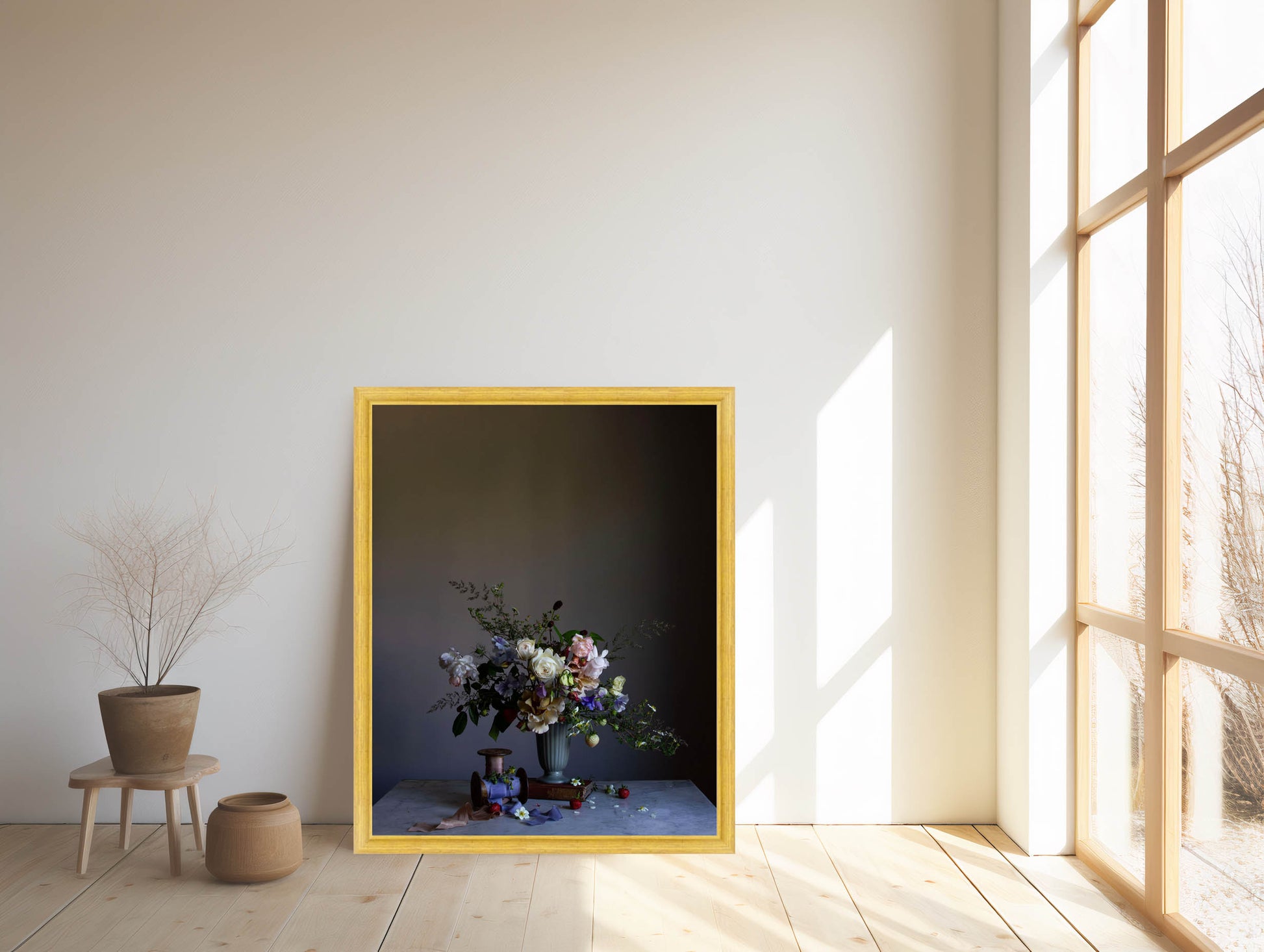 Framed artwork with a floral arrangement in a room with large windows.   Botanical artwork