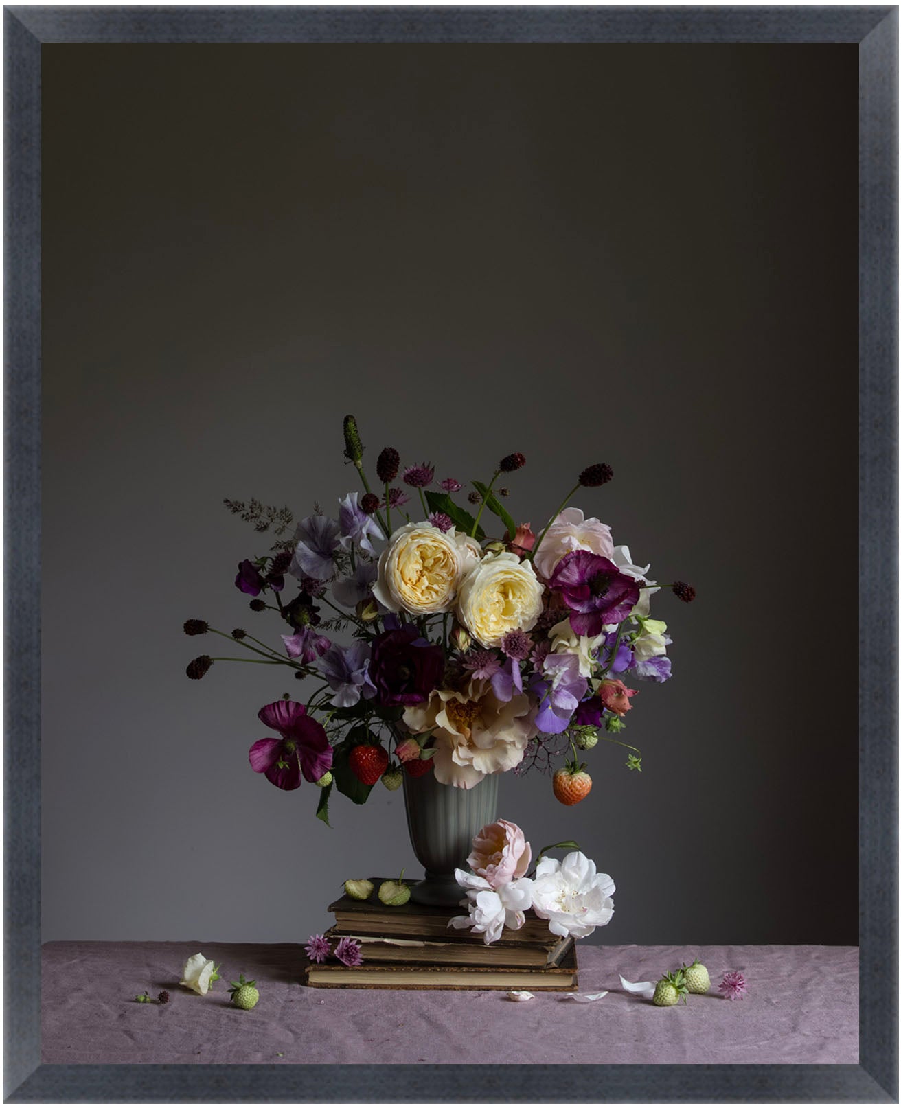 Floral arrangement in a vase with a small statue on a dark background.   Botanical picture