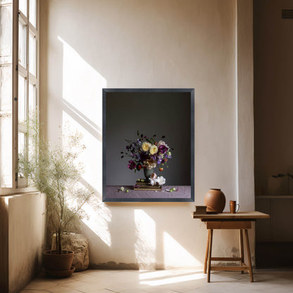 Framed artwork of a floral arrangement on a wall with natural light coming through a window.   Floral picture
